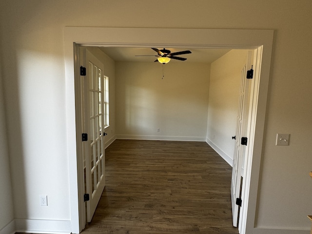 unfurnished room featuring dark hardwood / wood-style floors and ceiling fan