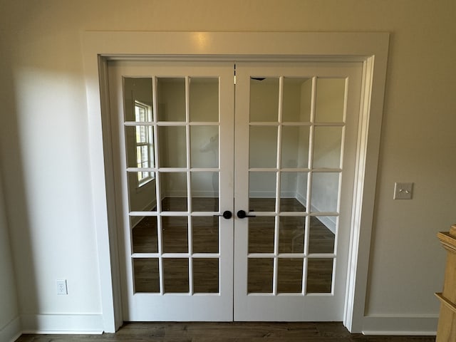 entryway featuring dark hardwood / wood-style flooring and french doors