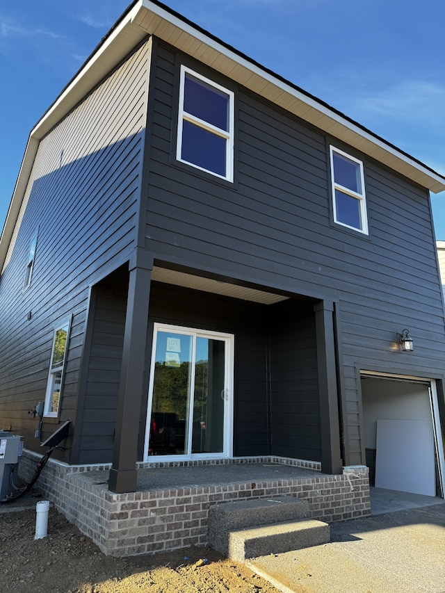 view of side of property featuring a garage