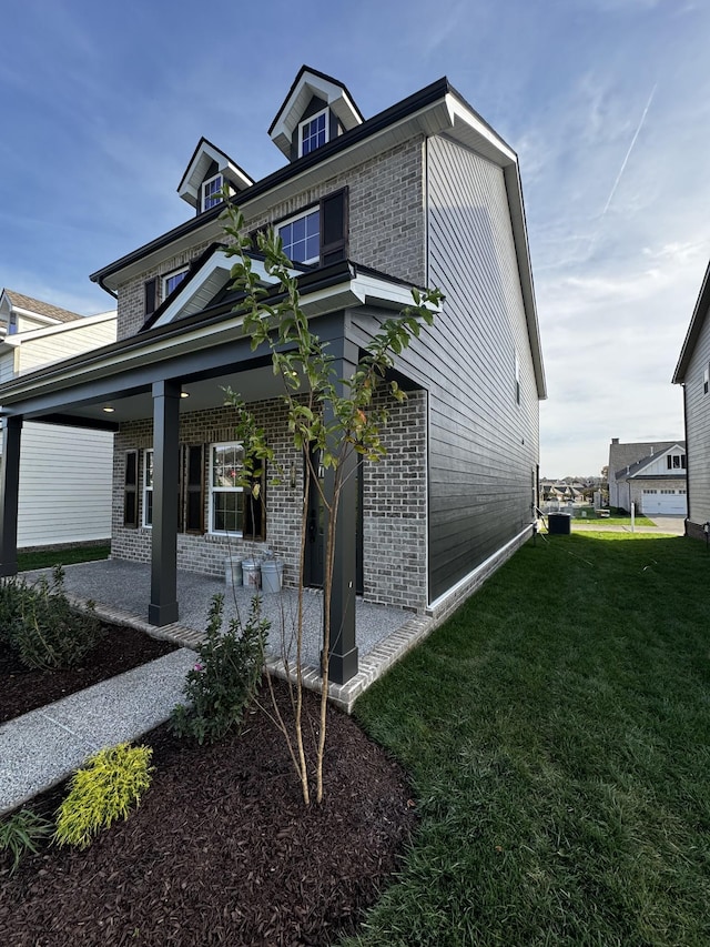 view of property exterior with a yard and a porch