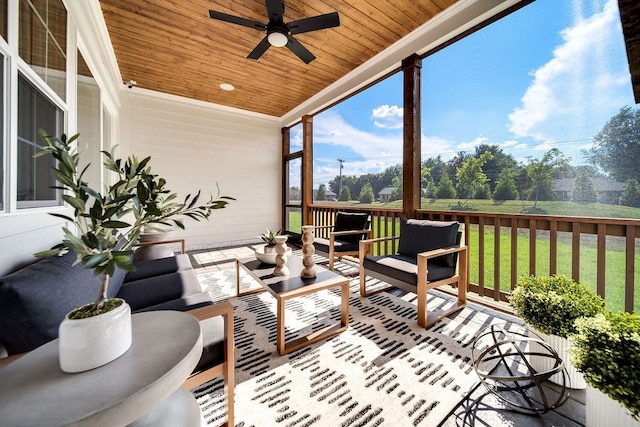 sunroom / solarium with wooden ceiling and ceiling fan