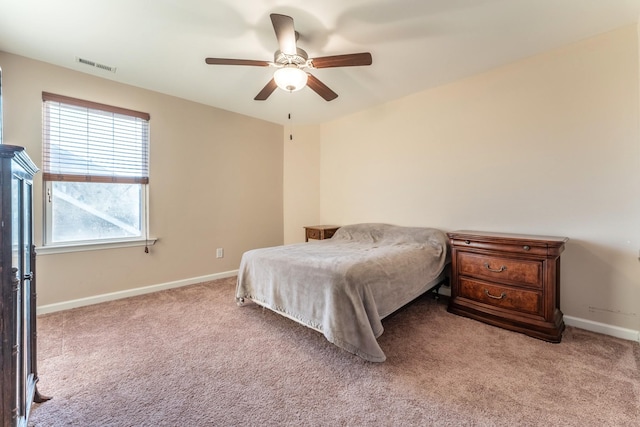 bedroom with ceiling fan and light colored carpet