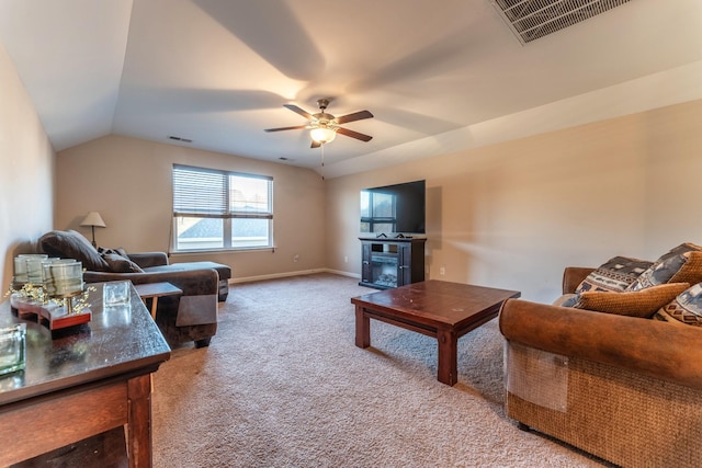 carpeted living room with ceiling fan and lofted ceiling