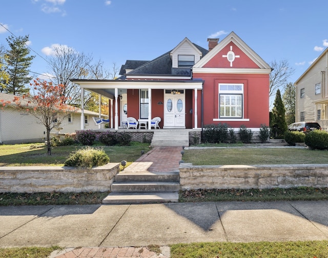 view of front of home with a front lawn and a porch