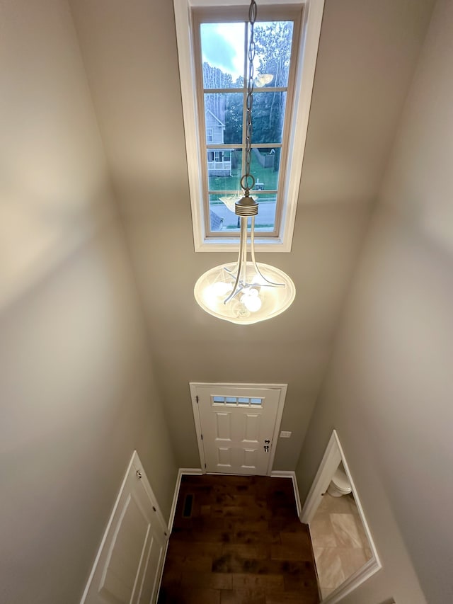 doorway with dark hardwood / wood-style floors