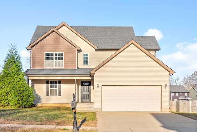 craftsman inspired home with a front yard and a garage