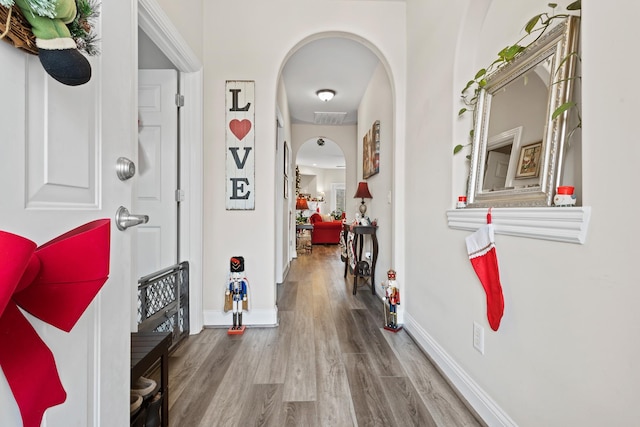 hall with wood-type flooring