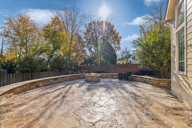 view of patio featuring an outdoor fire pit