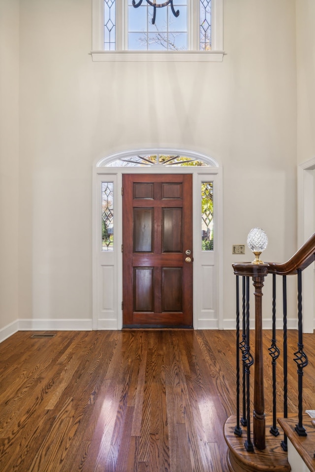 foyer with dark wood-type flooring