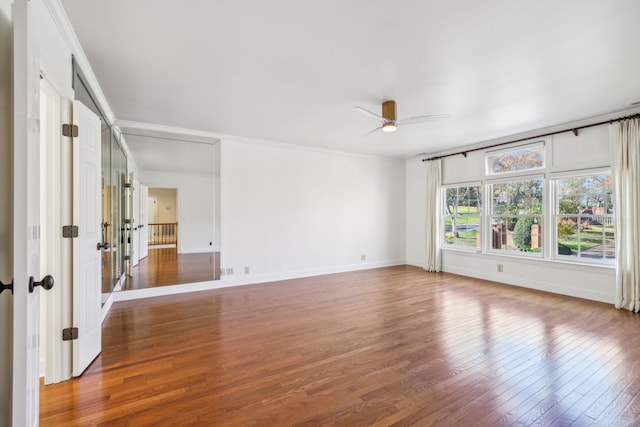 spare room featuring ceiling fan, ornamental molding, and hardwood / wood-style flooring