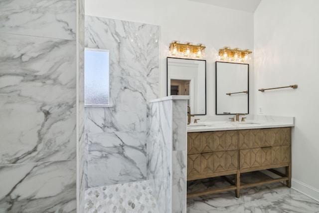 bathroom with vanity and a tile shower