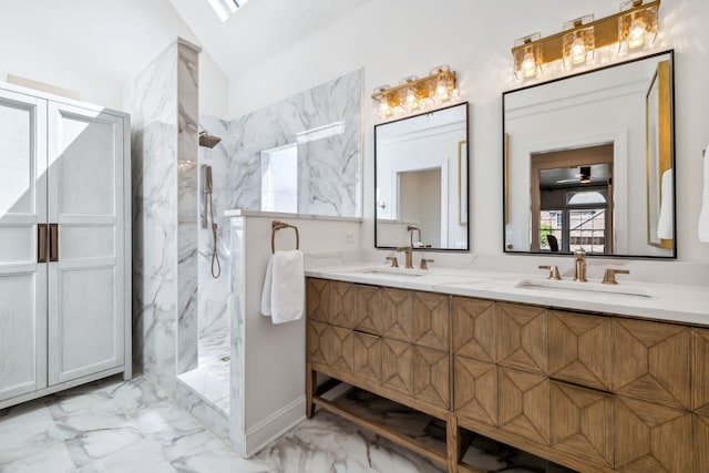 bathroom featuring ceiling fan, vanity, lofted ceiling, and tiled shower