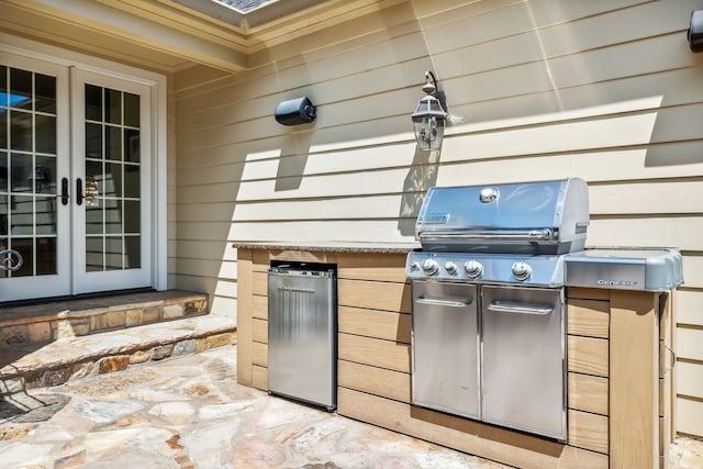 view of patio / terrace featuring a grill and french doors