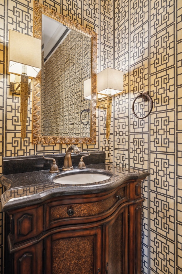 bathroom with vanity, tile walls, and ornamental molding