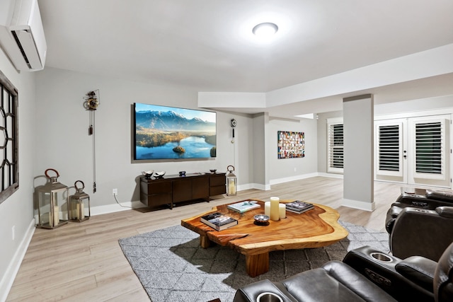 living room featuring french doors, light hardwood / wood-style floors, and a wall mounted AC