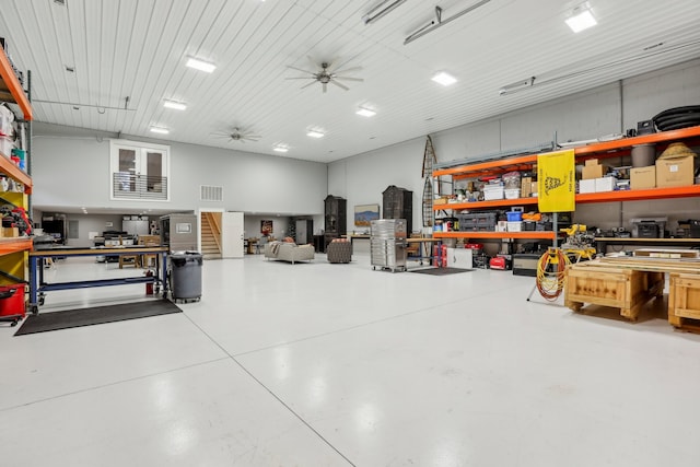 garage featuring a workshop area and ceiling fan