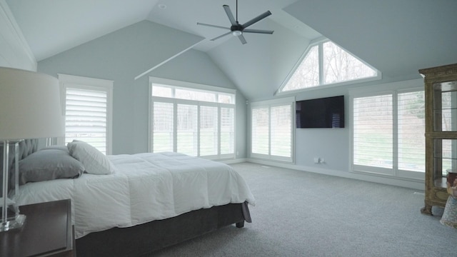 bedroom featuring light carpet, vaulted ceiling, and ceiling fan