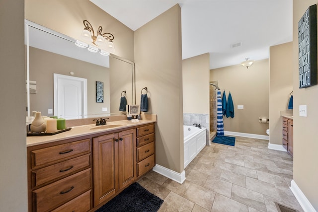 bathroom with separate shower and tub and vanity