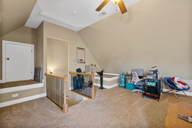 carpeted bedroom with ceiling fan and vaulted ceiling