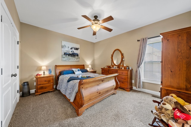 carpeted bedroom with a closet and ceiling fan