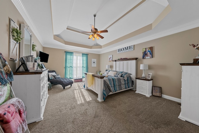 carpeted bedroom featuring a raised ceiling, ceiling fan, and ornamental molding