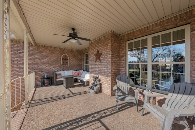 view of patio with outdoor lounge area and ceiling fan