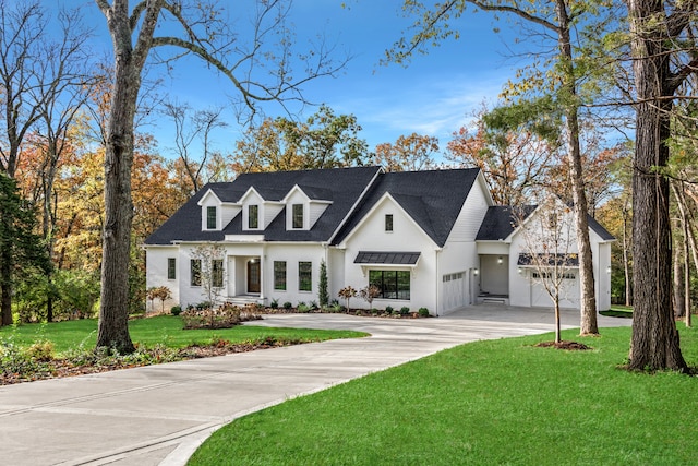 view of front facade featuring a garage and a front yard