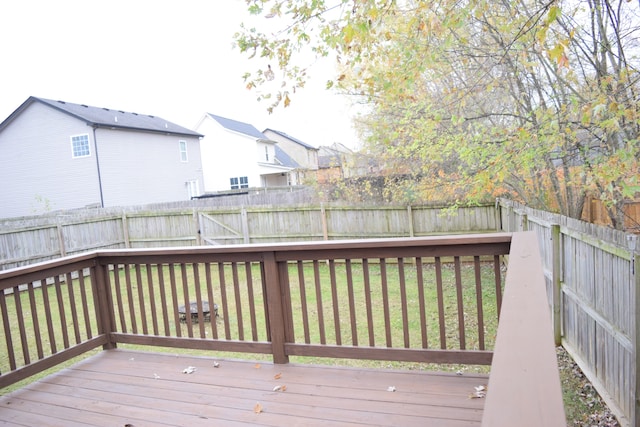 wooden deck with a yard