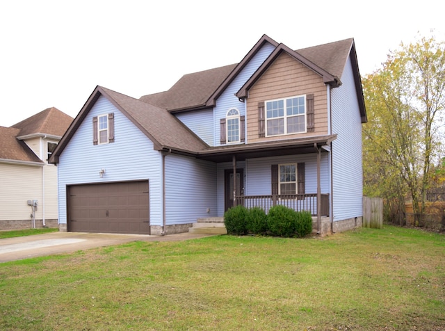 view of front of house featuring a porch, a garage, and a front lawn