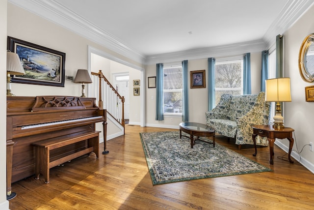 sitting room featuring hardwood / wood-style flooring and ornamental molding