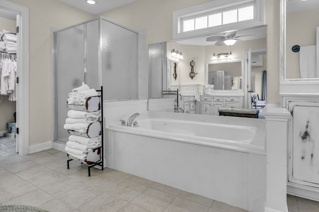 bathroom featuring tile patterned floors, vanity, ceiling fan, and independent shower and bath