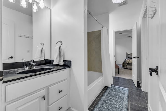 bathroom featuring tile patterned floors, shower / tub combo with curtain, and vanity