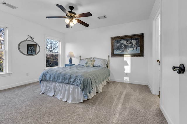 bedroom with light colored carpet and ceiling fan