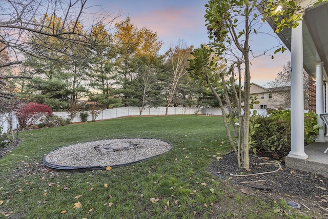 view of yard at dusk