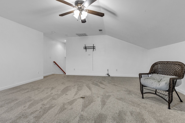 sitting room featuring carpet, ceiling fan, and vaulted ceiling