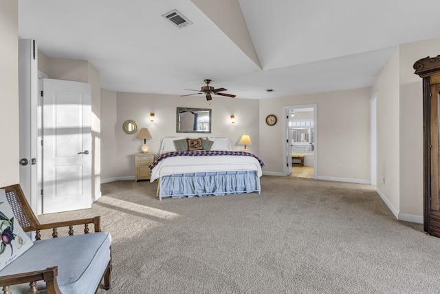 bedroom with connected bathroom, ceiling fan, light carpet, and lofted ceiling