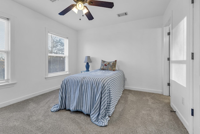 bedroom with light colored carpet and ceiling fan