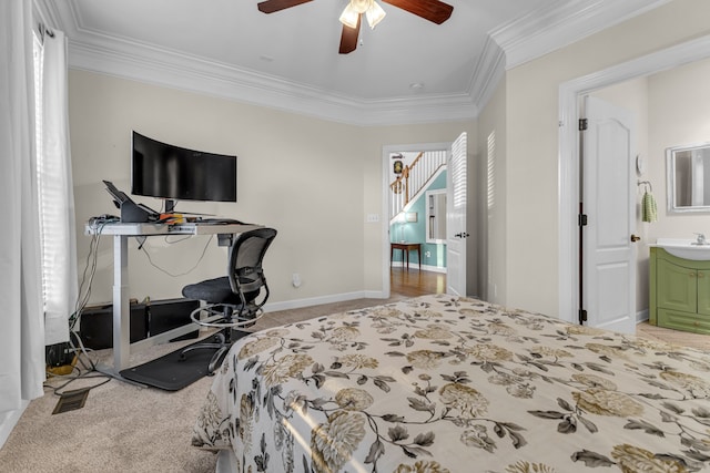 bedroom with ensuite bathroom, sink, crown molding, ceiling fan, and light colored carpet