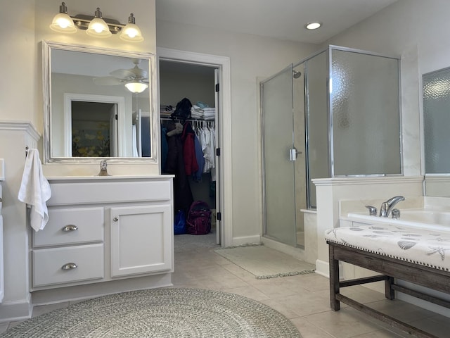 bathroom featuring vanity, tile patterned floors, walk in shower, and ceiling fan