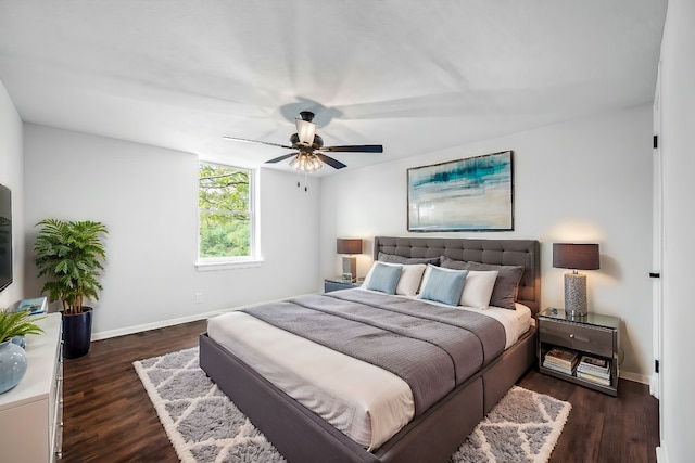 bedroom featuring dark hardwood / wood-style flooring and ceiling fan