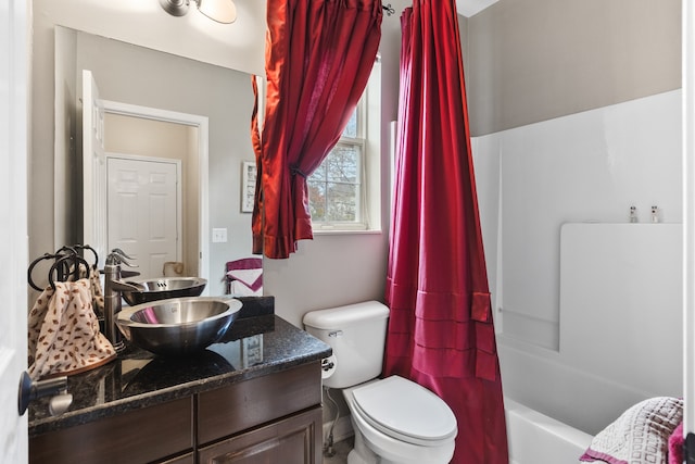 full bathroom featuring vanity, toilet, and shower / tub combo with curtain