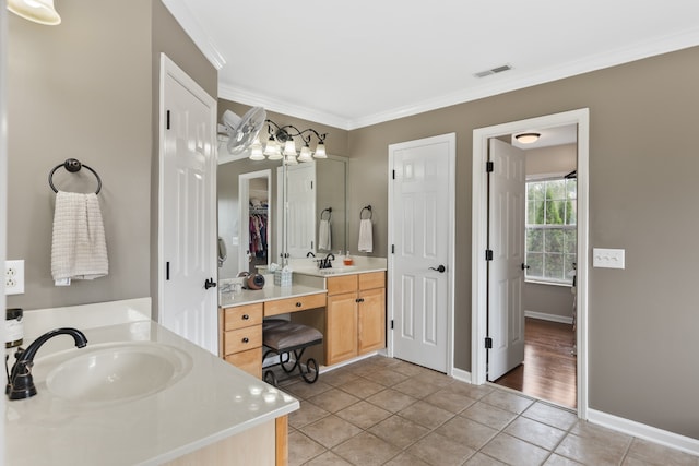 bathroom featuring vanity, tile patterned floors, and crown molding