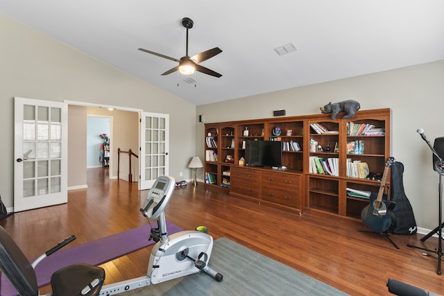 workout room featuring hardwood / wood-style floors, ceiling fan, lofted ceiling, and french doors