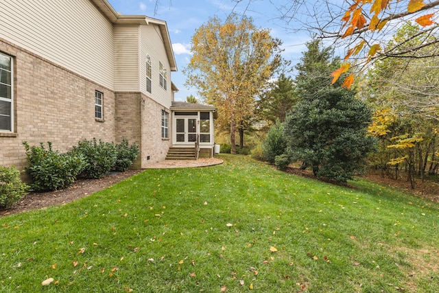 view of yard with a sunroom