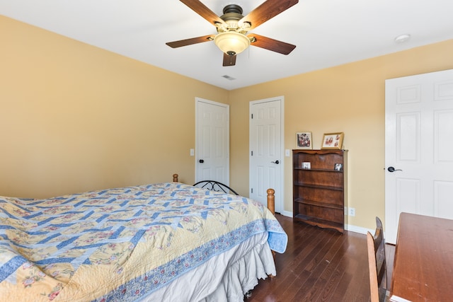 bedroom featuring ceiling fan and dark wood-type flooring