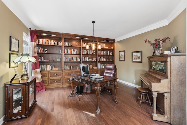 home office with dark hardwood / wood-style flooring, ornamental molding, and a chandelier