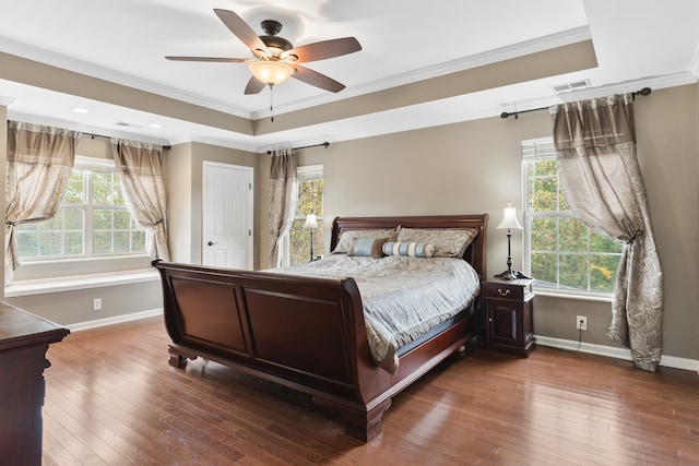 bedroom with hardwood / wood-style floors, ceiling fan, and ornamental molding