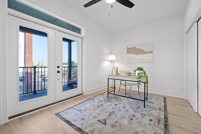 entryway with french doors, light hardwood / wood-style floors, and ceiling fan