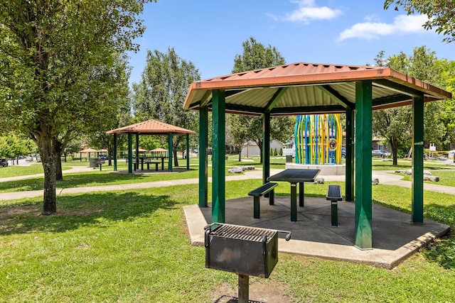 view of community featuring a gazebo, a playground, and a yard