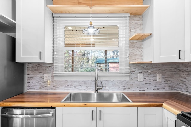 kitchen with white cabinets, pendant lighting, dishwasher, and sink